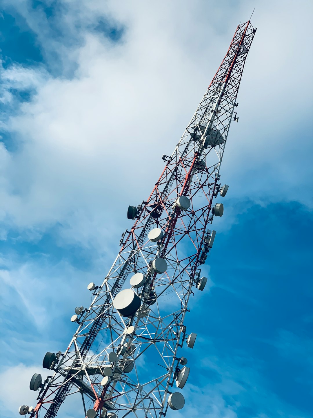 gray-and-red-telecommunications-tower-s8p1bzjm5fg